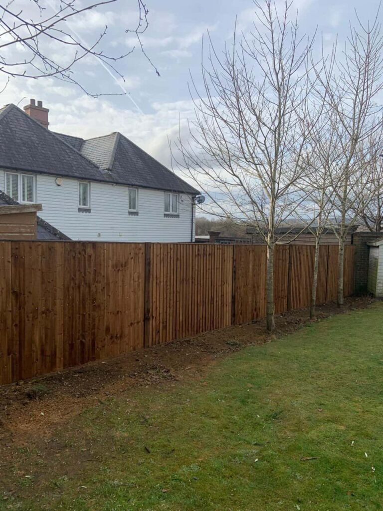 This is a photo of feather edge fencing installed in a residential properties garden by Fast Fix Fencing Wisbech