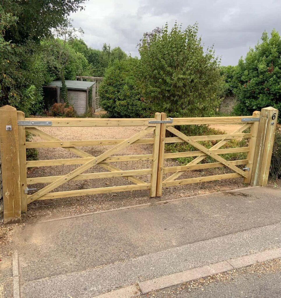 This is a photo of a wooden driveway gate installed by Fast Fix Fencing Wisbech
